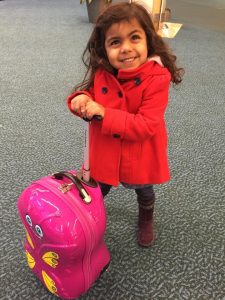 A pink butterfly suitcase for all my daughter's prized possessions! And it fits under the seat.