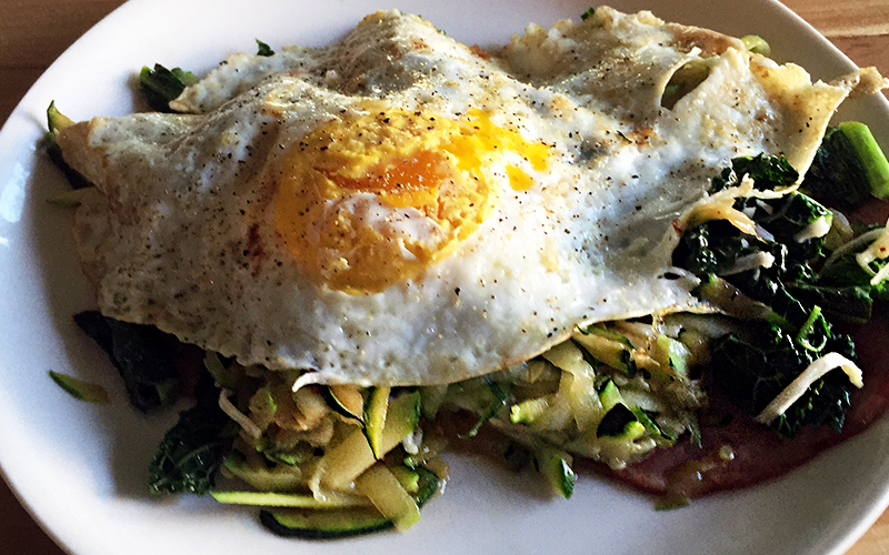 My breakfast: an egg over kale, zucchini, and a slice of ham... Yum!